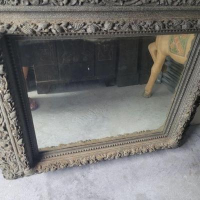 Mirror with ornate frame, approximately 48
