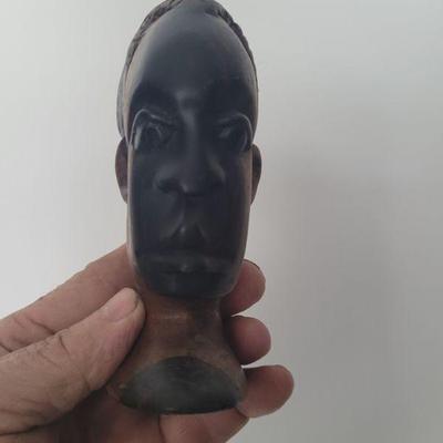 One of a pair of hand carved male head bust figurine, very good condition, measures approximately 7