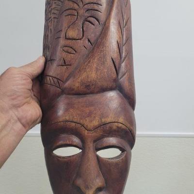 This is one of a pair of hand carved African masks/wall art. It is in very good condition and measures approximately18