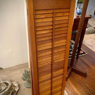 Interior wood shutters used as room divider