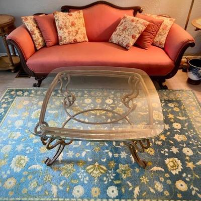 Antique sofa and glass-topped coffee table