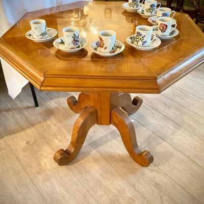 Antique octagon table with wooden floral inlays