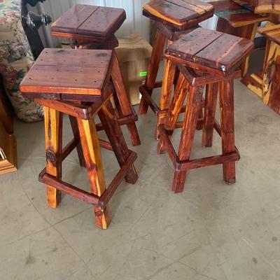 Four swivel cedar stools