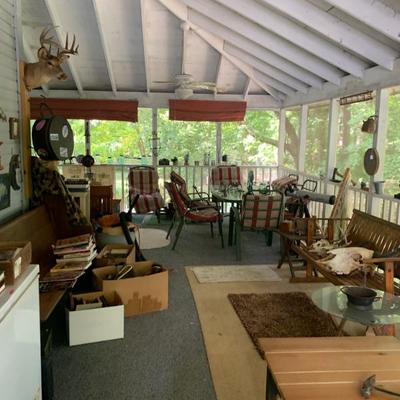 A  large screen porch full of some fantastic items