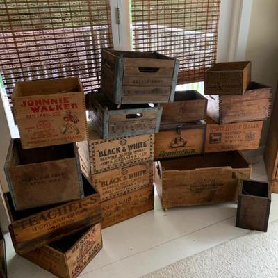 Many  collectible wood boxes and crates 