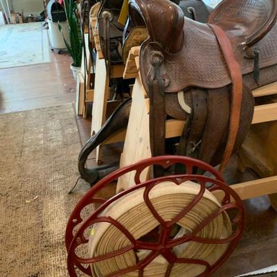 Sweet old fire hose reel and 3  great saddles
