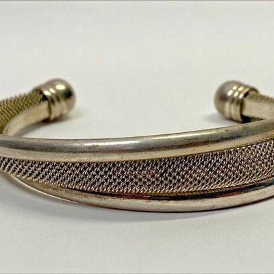 https://www.ebay.com/itm/125506622253	PO1072 TIFFANY & CO BRACELET CUFF STERLING SILVER SOLID AND MESH BAND		Auction
