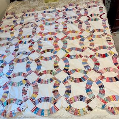 Pieced double wedding ring quilt top