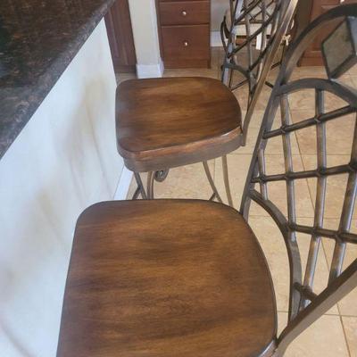 Two stools that match the dinette table and chairs