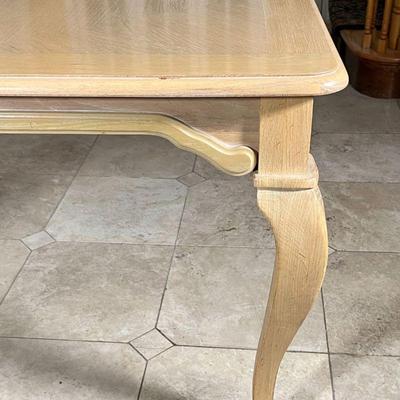 LIGHT WOOD EXTENSION DINING TABLE | Likely Thomasville, with one leaf, having a parquetry style top and cabriole legs; h. 29-1/2 x w....