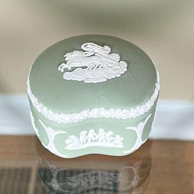WEDGWOOD JADE GREEN BOX | Showing a rider with chariot, shaped lidded box, stamped on the bottom; h. 1-1/2 x 3 x 3 in.