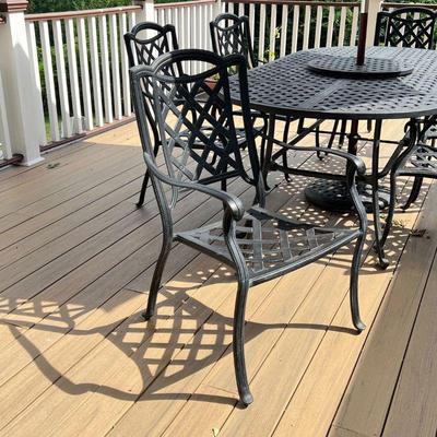 (8pc) HANAMINT PATIO FURNITURE SUITE | Outdoor dining set including a dining table (h. 28-1/2 x 84-1/2 in.), six matching armchairs (h....