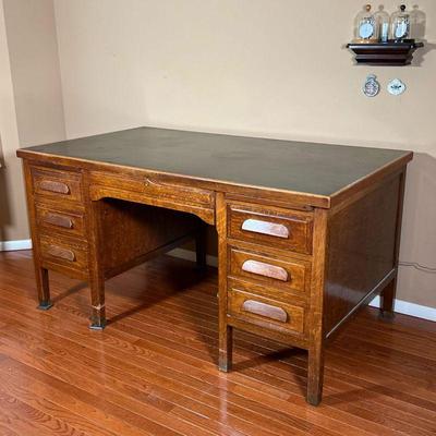 VINTAGE DESK | Solid wood kneehole desk with two banks of three drawers centering a middle drawer; interesting drawer mechanism- the...