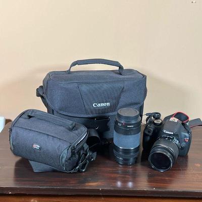 CANON EOS REBEL T5 | With a Canon carrying case, charger, and two lenses: a Canon 18-55mm lens and a Canon 75-300mm telephoto lens