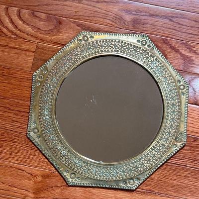 OCTAGONAL BRASS MIRROR | Round mirror within in an octagonal brass frame with patina - dia. 12-1/8 in.