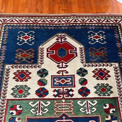 GEOMETRIC AREA RUG | With blue, green, and red geometric devices within concentric geometric borders - 6 ft. 5 in. x 4 ft. 4 in.