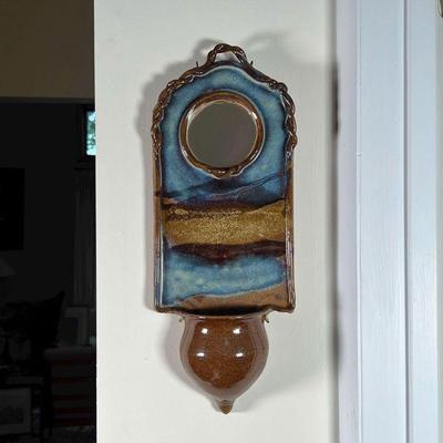 POTTERY WALL POCKET | Wall pocket with small round mirror, blue and brown glazed pottery, apparently unsigned - h. 15-1/2 x 6-1/4 in.