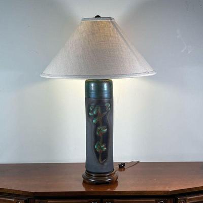 JAPANESE CERAMIC LAMP | Modern Japanese table lamp, of cylindrical form with green glazed characters, mounted on a wood base, with a...