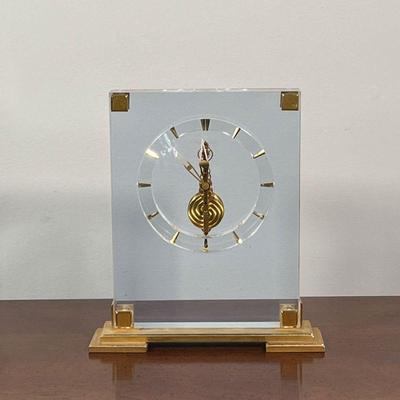 JAEGER-LE COULTRE CLOCK | Small lucite and brass mantle clock, having bullet hour markers, with original box - h. 7-3/4 x 7-1/8 in.
