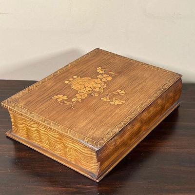 INLAID WOOD BOX | Trinket box inlaid with contrasting wood, designed in the form of a book, the lid with an urn with a flower arrangement...