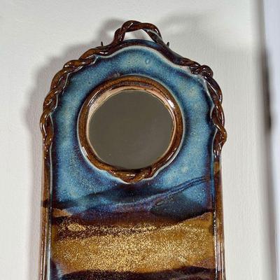 POTTERY WALL POCKET | Wall pocket with small round mirror, blue and brown glazed pottery, apparently unsigned - h. 15-1/2 x 6-1/4 in.