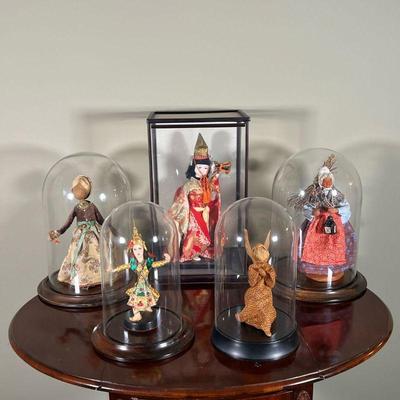 (5pc) DOLLS IN DISPLAY CASES | Some in bell jar glass displays - h. 15-1/2 x w. 10-1/2 x d. 8 in., largest