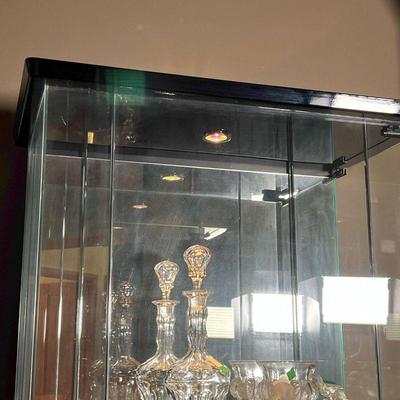 CONTEMPORARY DISPLAY CABINET | With mirrored back and glass side and front panel, with glass door opening on the right side,...