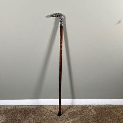 SILVER HANDLED WALKING STICK | Cane with a repousse sterling silver handle - l. 33 in.
