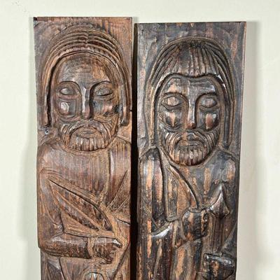 PAIR CARVED WOOD SAINTS | Carved wood wall hanging plaques of saintly figures including St. Francis and a man with bow and arrow - h....