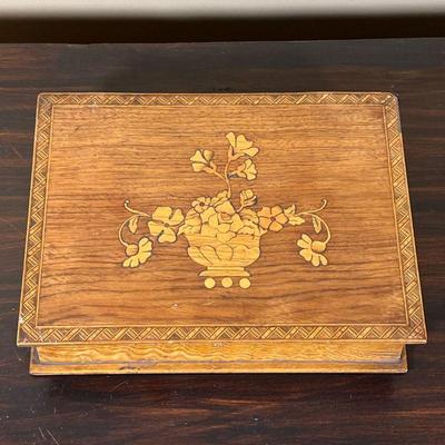 INLAID WOOD BOX | Trinket box inlaid with contrasting wood, designed in the form of a book, the lid with an urn with a flower arrangement...