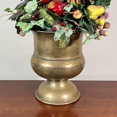 HAMMERED BRASS URN | With faux fruit arrangement; overall h. 28 in. - h. 12 in. (urn)