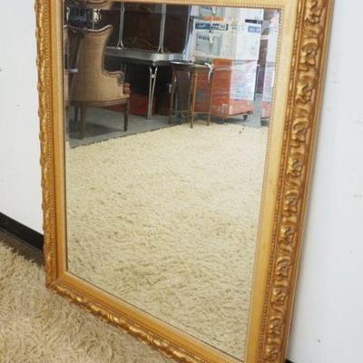 1264	BEVEL EDGE MIRROR IN ORNATE GILT FRAME, APPROXIMATELY 39 IN X 49 IN
