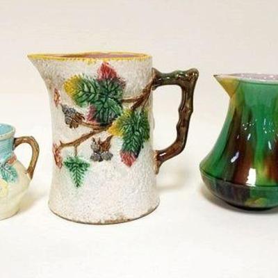 1089	GROUP OF 5 ANTIQUE MAJOLICA PITCHERS & CREAMERS, 2 SMALL SPOUT CHIPS ON CREAMER, TENUOUS MAJOLICA, TALLEST IS APPROXIMATELY 9 IN HIGH
