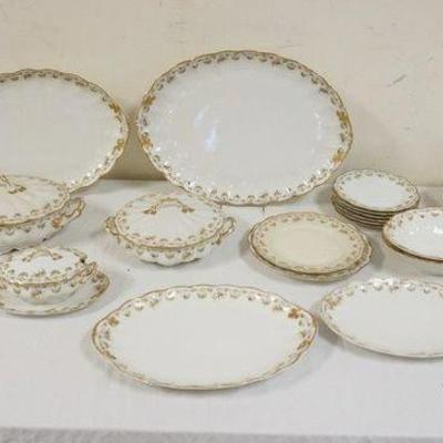1157	29 PIECES LIMOGES CHINA DECORATED W/A FLORAL BORDER & GILT TRIM, SOME WEAR TO TRIM
