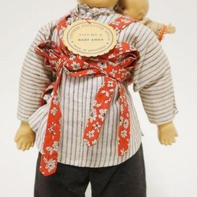 1055	CHINESE COMPOSITION DOLL *BABY AMAH* TYPE 2 W/ORIGINAL TAG, APPROXIMATELY 12 IN HIGH
