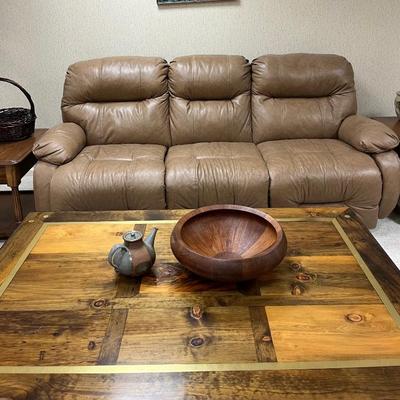 Leather sofa with two recliners.
