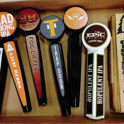 Large collection of beer tap handles