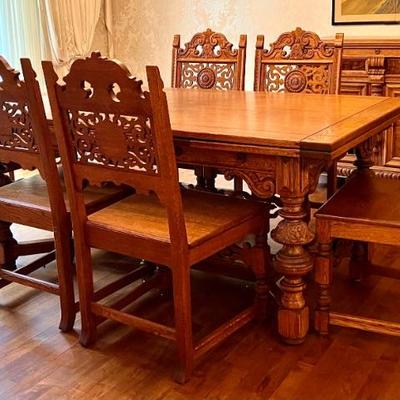 Antique Jacobean Style Dining Room Table and Six Chairs. Truly a gorgeous table with intricate details. In very good condition with light...