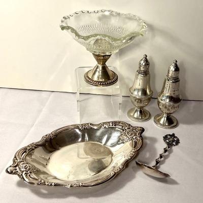 Array of Vintage Sterling Silver Dishes. Includes sterling base compote, weighted salt and pepper shakers, Norwegian sterling spoon and a...