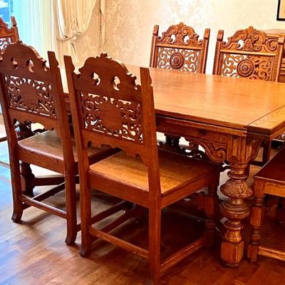 Antique Jacobean Style Dining Room Table and Six Chairs. Truly a gorgeous table with intricate details. In very good condition with light...
