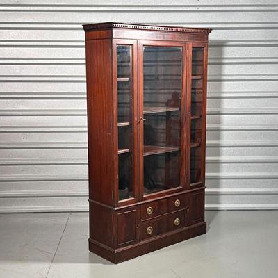 ANTIQUE DISPLAY CABINET  |
Having three front glazed doors over two drawers flanked by small cabinet doors - h. 64 x w. 38 x d. 13 in.