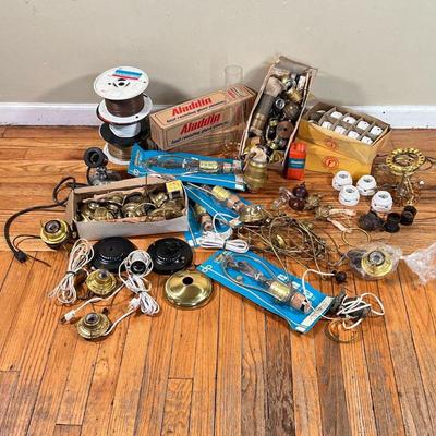 MISC. LAMP REPAIR ITEMS  |
A group of assorted lamp repair parts, including insulated wire, glass hurricane shades, finials, harps, etc.