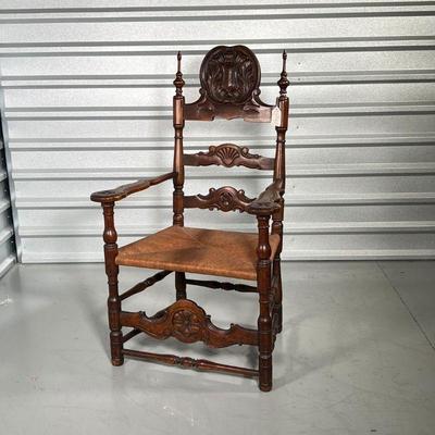 CARVED SHIELD ARMCHAIR  | 19th century, carved wood armchair crested by an intricately carved shield, with rush seat - h. 43-1/2 x 26 x...