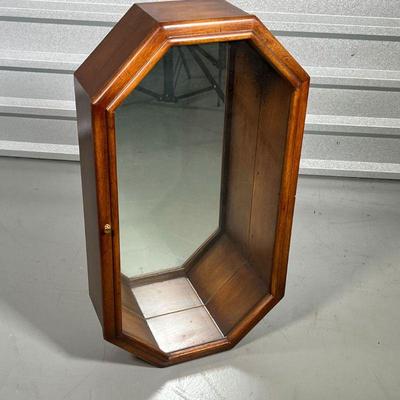 OCTAGONAL WOOD DISPLAY CASE  | Having a mirrored interior and a single glaze glass door, with 