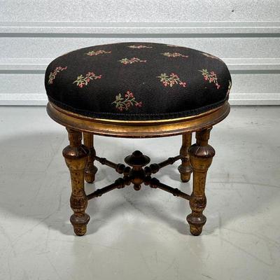 FRENCH FOOTSTOOL  |
Gilt French foot stool, circa 19th century, with a black upholstered cushioned top with pink floral motif - h. 15 x...