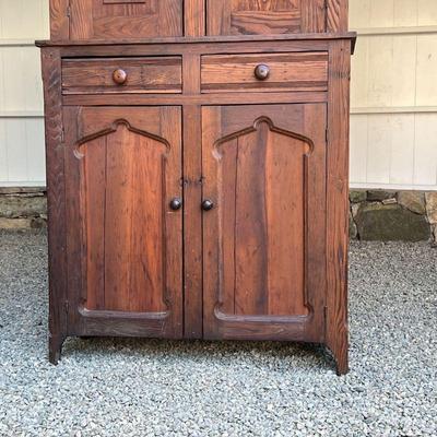 ANTIQUE COUNTRY CUPBOARD  |
Of two-piece construction, the top section with double cabinet doors with vintage hardware, the lower section...