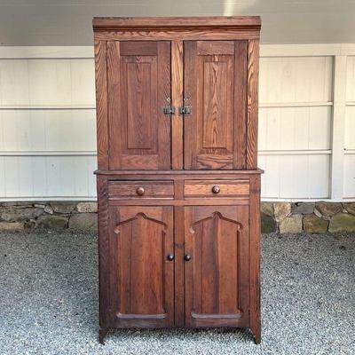 ANTIQUE COUNTRY CUPBOARD  |
Of two-piece construction, the top section with double cabinet doors with vintage hardware, the lower section...