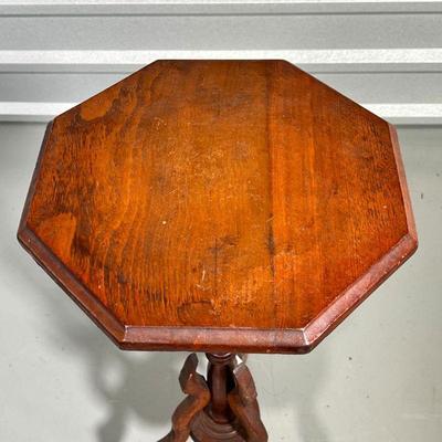 ANTIQUE PLANT STAND  |
19th century, hand carved, octagonal top with a tripod base - h. 27-1/2 x 13-1/4 x 13-1/4 in.