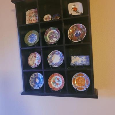 smaller shadow box with plates, sold separately