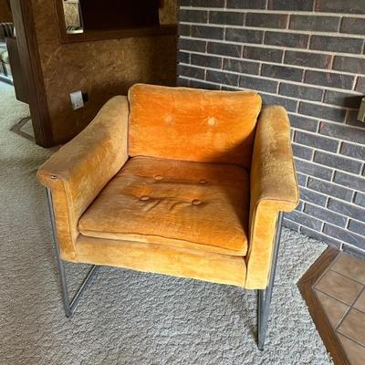 1970s orange club chair with chrome frame